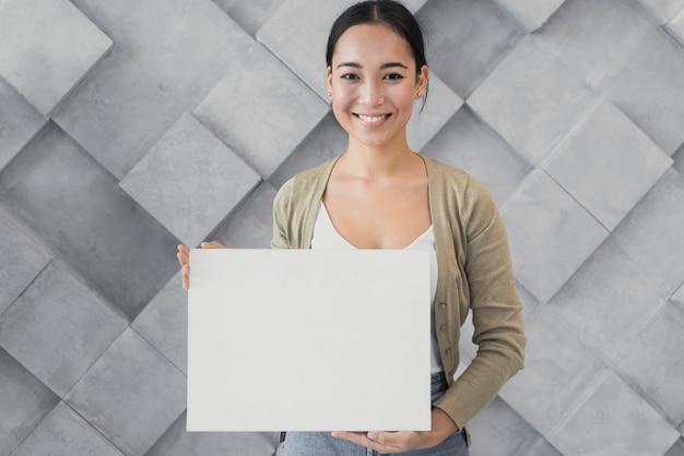 Portrait smiley young woman at office