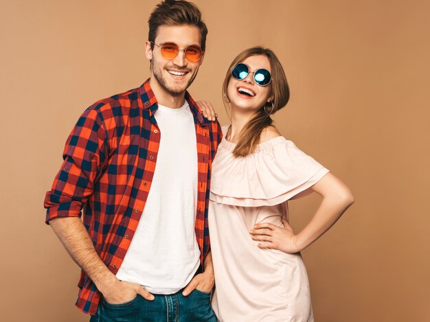 Portrait of Smiling Beautiful Girl and her Handsome Boyfriend laughing.