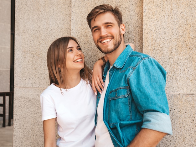 Free photo portrait of smiling beautiful girl and her handsome boyfriend. woman in casual summer jeans clothes.