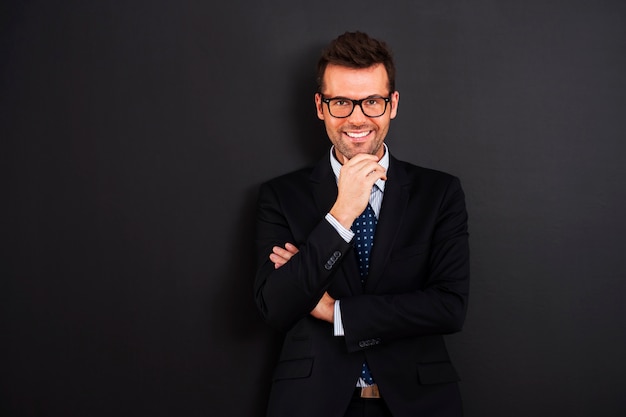 Portrait of smiling businessman wearing glasses