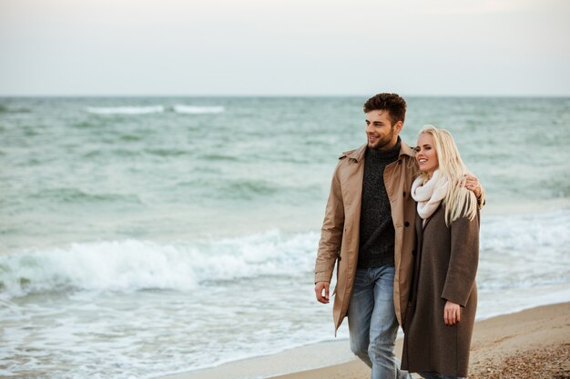 Portrait of a smiling couple in love hugging