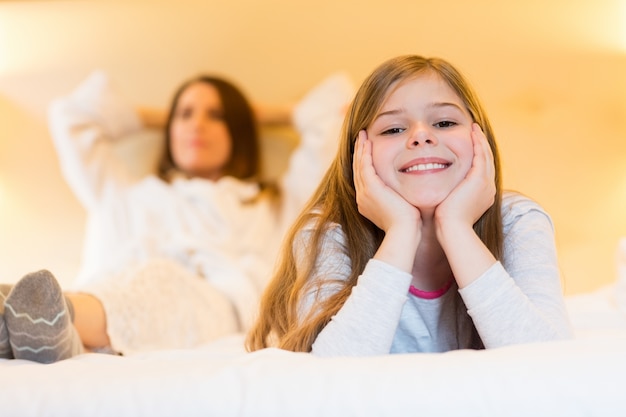 Portrait of smiling girl in bedroom