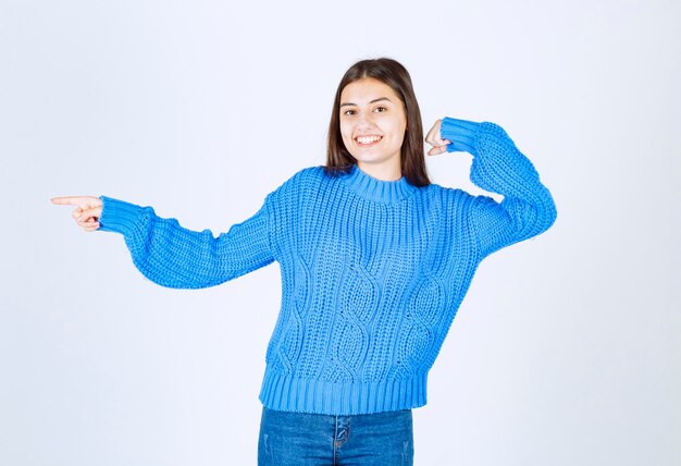 Portrait of smiling girl posing on white.