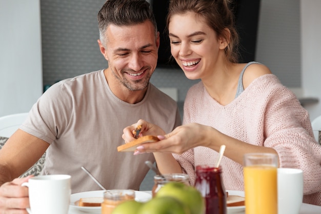 Portrait of a smiling loving couple having breakfast