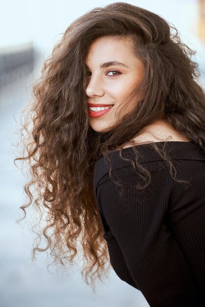 Portrait of smiling model outdoors