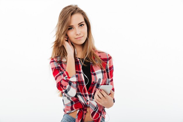 Portrait of a smiling pretty girl in plaid shirt