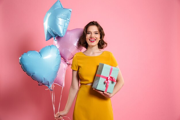 Portrait of a smiling pretty woman in dress