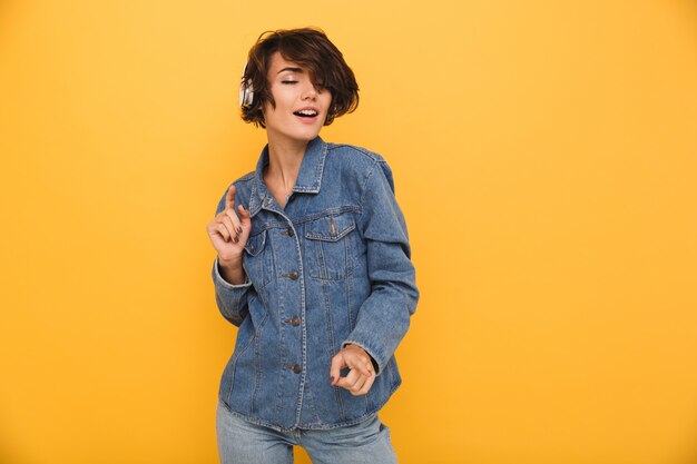 Portrait of a smiling satisfied woman dressed in denim jacket