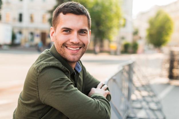 Portrait of smiling stubble man at outdoors