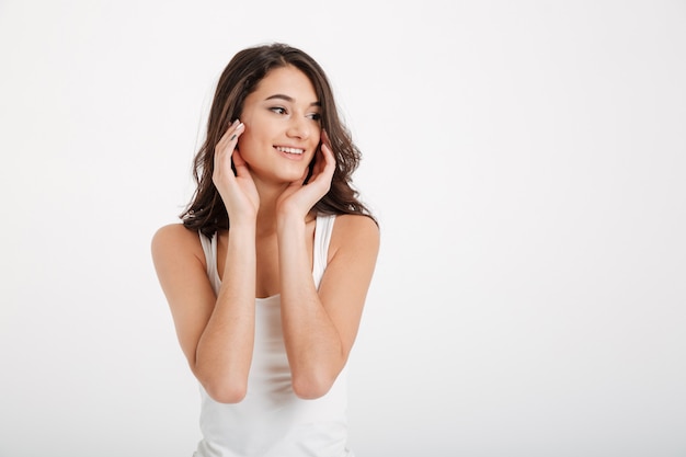 Portrait of a smiling woman dressed in tank-top