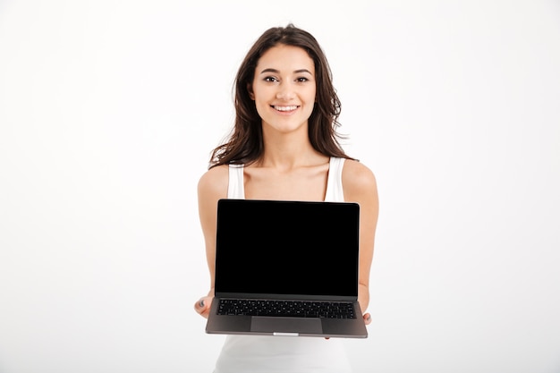 Portrait of a smiling woman dressed in tank-top