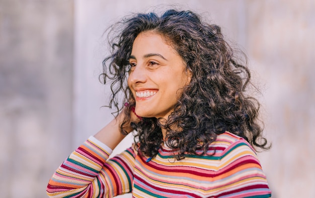 Portrait of a smiling young woman in colorful t-shirt