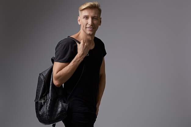 Portrait smilingyoung man with backpack