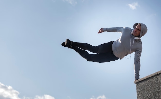 Portrait of sportive man doing parkour