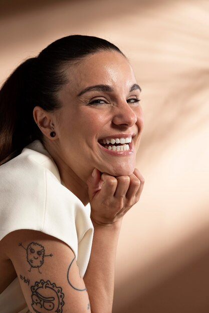 Portrait of stylish brunette woman posing and smiling