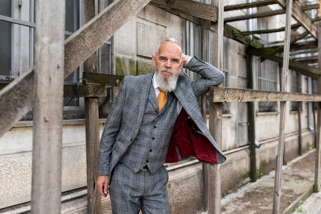 Portrait of stylish senior man in costume