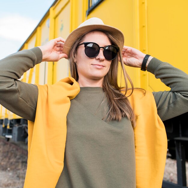 Portrait of stylish woman with sunglasses and hat