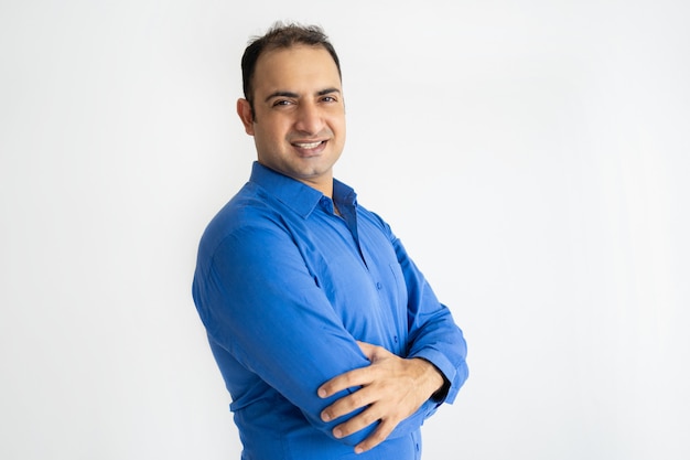 Portrait of successful mid adult Indian businessman smiling