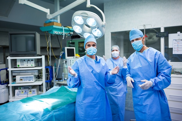 Portrait of surgeons preparing for operation in operation room