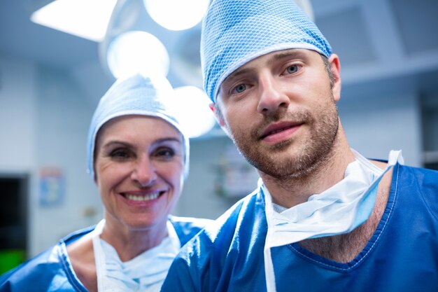 Portrait of surgeons standing in operation room