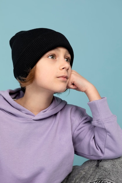 Portrait of teen boy posing and thinking