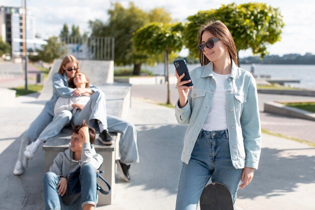 Portrait of teenage girl next to her friends