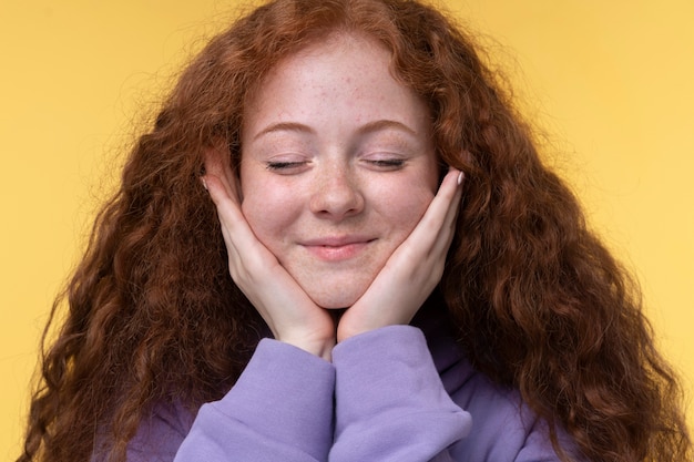 Free Photo portrait of teenage girl looking angelic