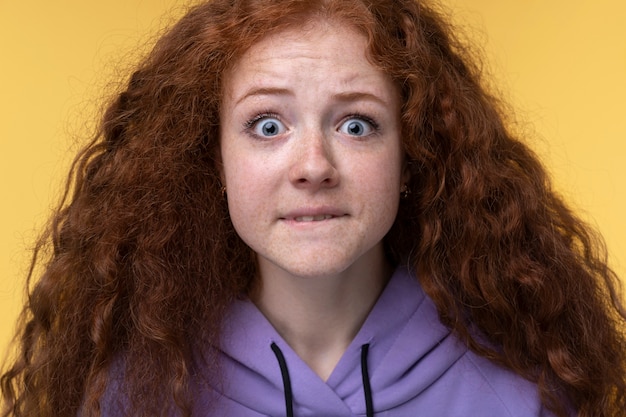 Free Photo portrait of teenage girl looking scared