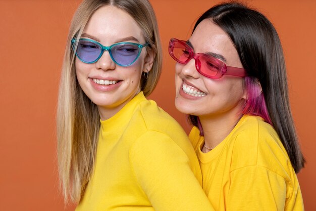 Portrait of teenage girls wearing sunglasses