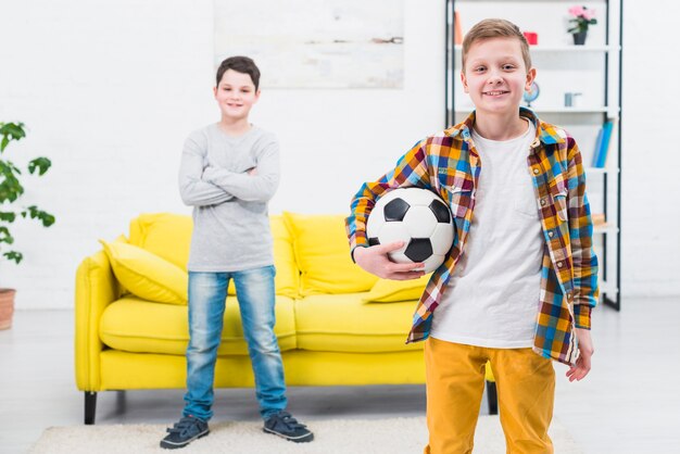 Portrait of two boys at home