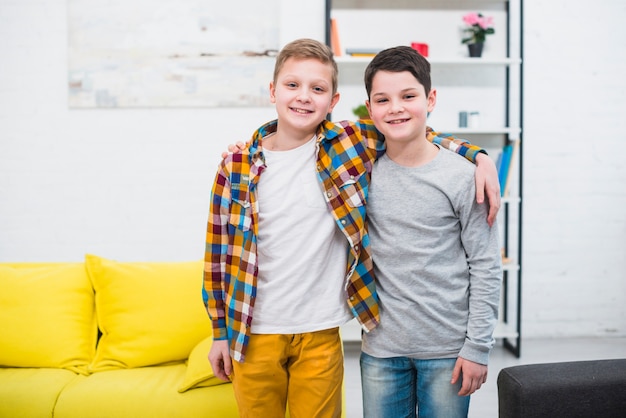 Free photo portrait of two boys at home