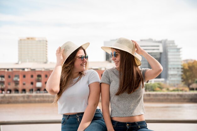 Portrait of two girls in urban environment having fun