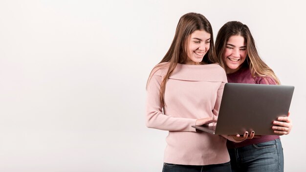 Portrait of two girls on white background