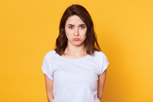 Portrait of of unhappy beautiful woman with curves lips