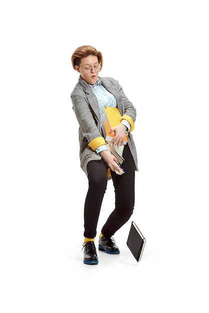 Free photo portrait of a unhappy female student holding books