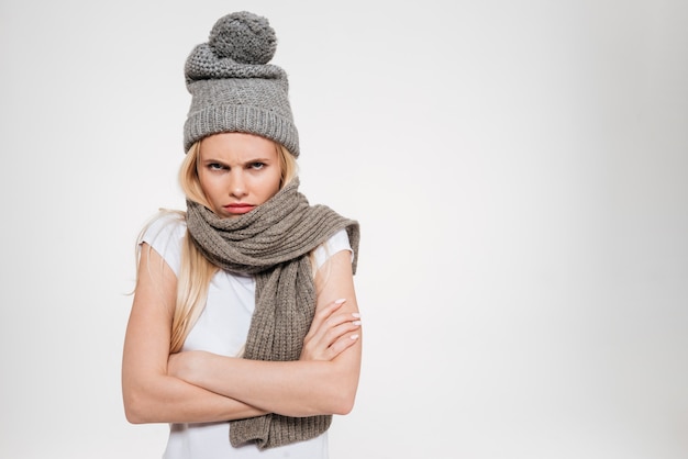 Free Photo portrait of an upset unsatisfied woman in winter hat