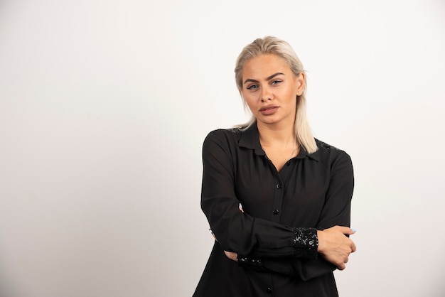 Free Photo portrait of woman in black shirt posing on white background. high quality photo