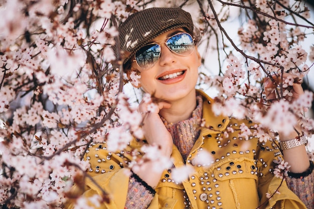 Free Photo portrait of woman in blooming flowers