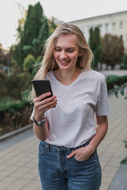 Portrait of a woman checking her phone