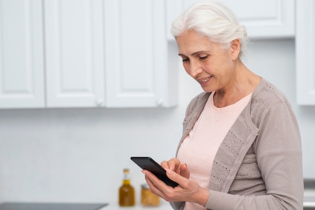 Portrait of woman checking her phone