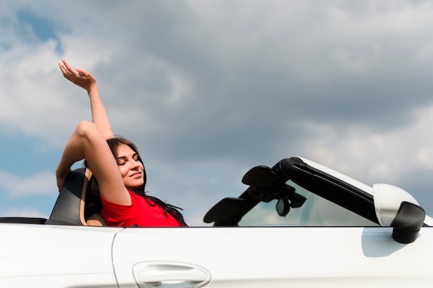 Free photo portrait of woman on cloudy day