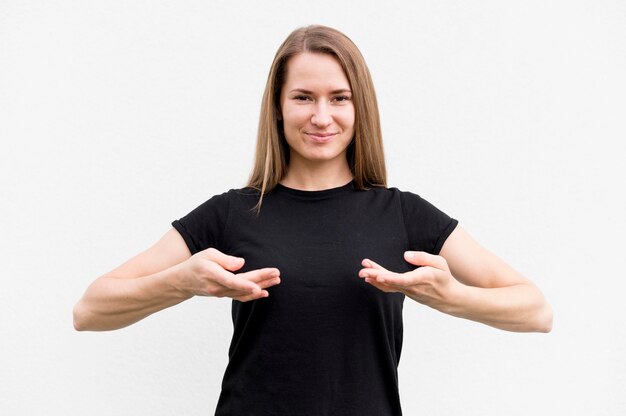 Portrait of woman communicating through sign language