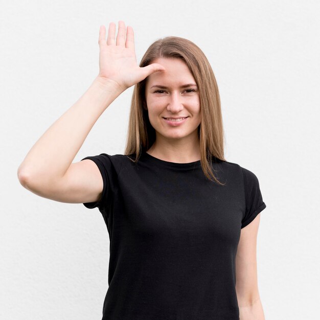 Portrait of woman communicating through sign language