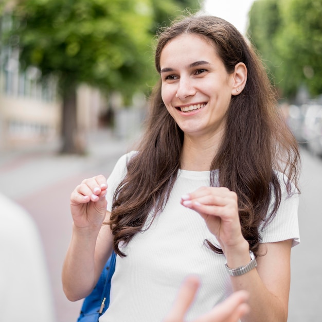 Portrait of woman communicating through sign language