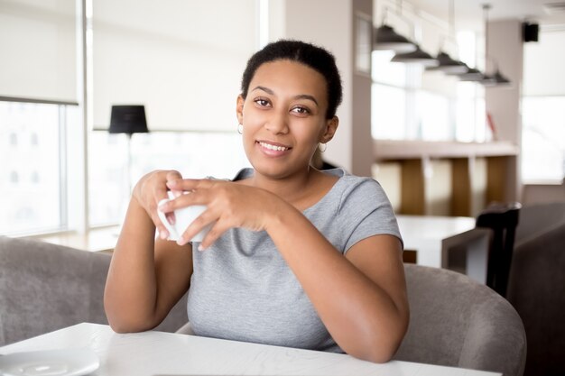 portrait woman cup happy resting