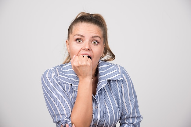 Free Photo portrait of woman feeling angry on gray wall.