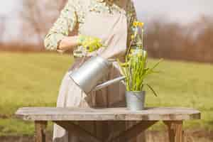 Free photo portrait of woman gardening