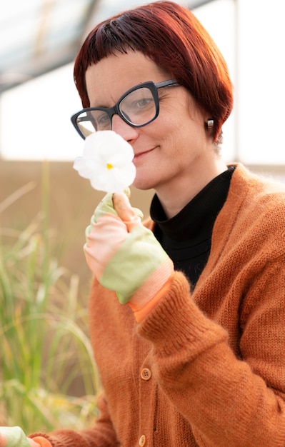 Free Photo portrait woman growing plants