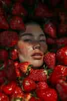 Free photo portrait of  woman interacting with fruits