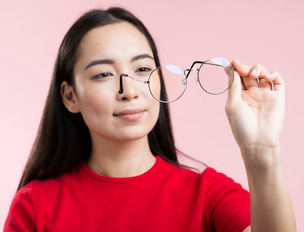 Portrait woman looking at glasses